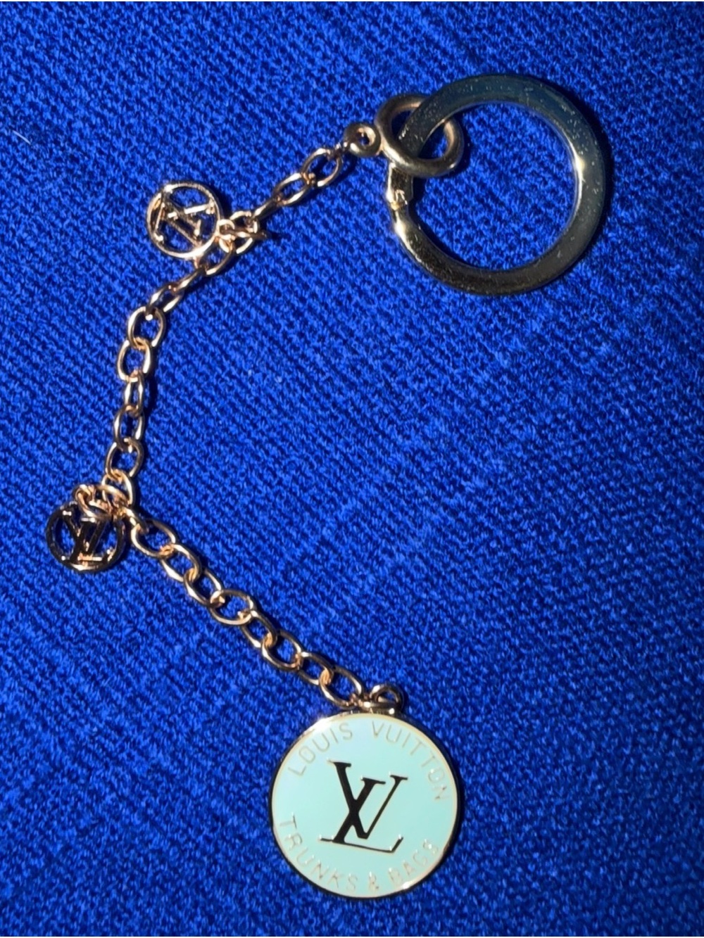 Blue emblem with “Louis Vuitton” Gold-Tone Blue Enamel Charm Keychain. Not Ath